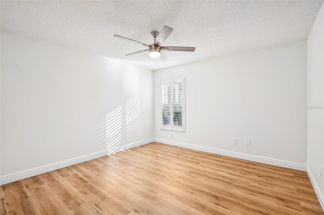 unfurnished room featuring ceiling fan, a textured ceiling, and light wood-type flooring