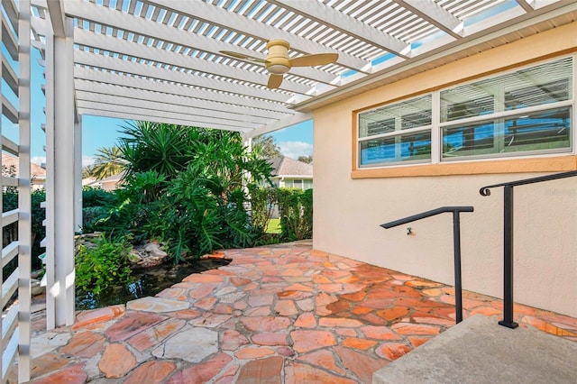 view of patio / terrace with ceiling fan and a pergola