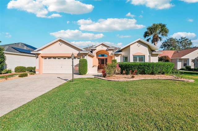 ranch-style house with a garage and a front yard