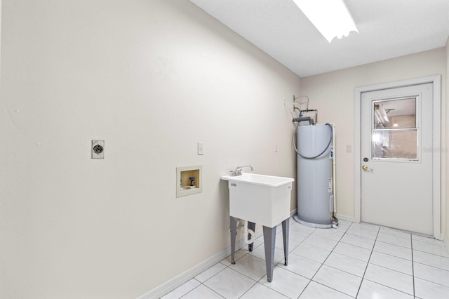 laundry area with hookup for a washing machine, electric water heater, light tile patterned floors, and electric dryer hookup