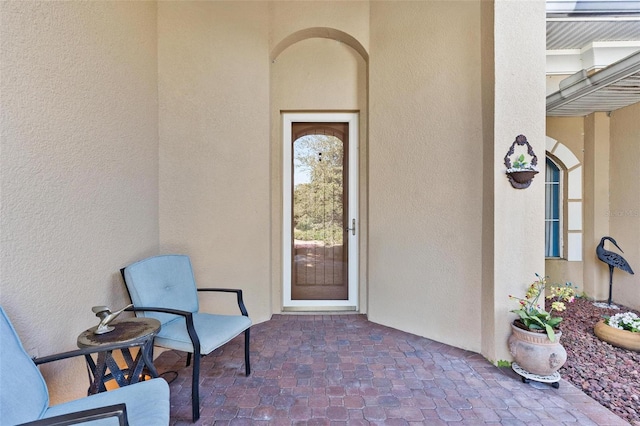 doorway to property featuring a patio area