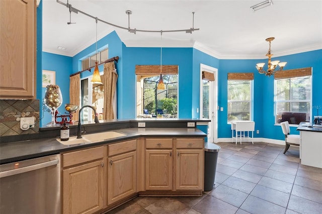 kitchen featuring stainless steel dishwasher, decorative light fixtures, a healthy amount of sunlight, and sink