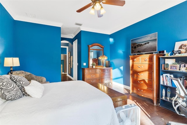 bedroom with ceiling fan, dark hardwood / wood-style flooring, and crown molding