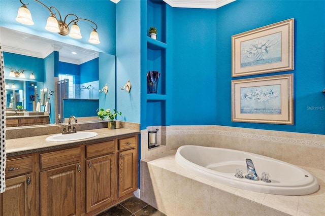 bathroom featuring vanity, tiled bath, tile patterned floors, and crown molding