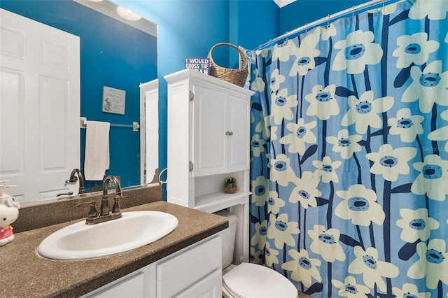 bathroom with vanity and toilet