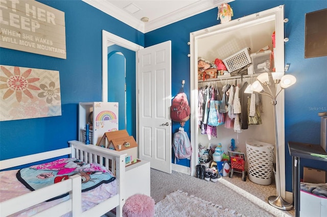 bedroom with carpet, a closet, and crown molding