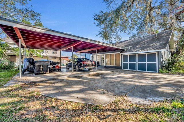 view of parking / parking lot with a carport