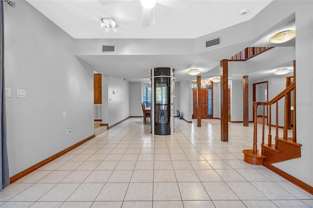 unfurnished room featuring ceiling fan and light tile patterned flooring