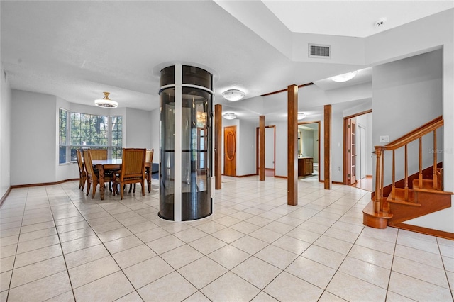 interior space with light tile patterned floors