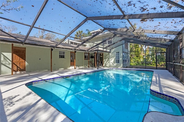 view of pool featuring a patio and a lanai