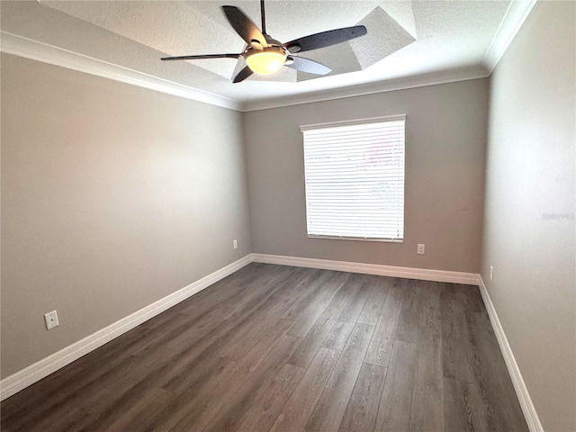 empty room with dark hardwood / wood-style floors, ceiling fan, ornamental molding, and a textured ceiling