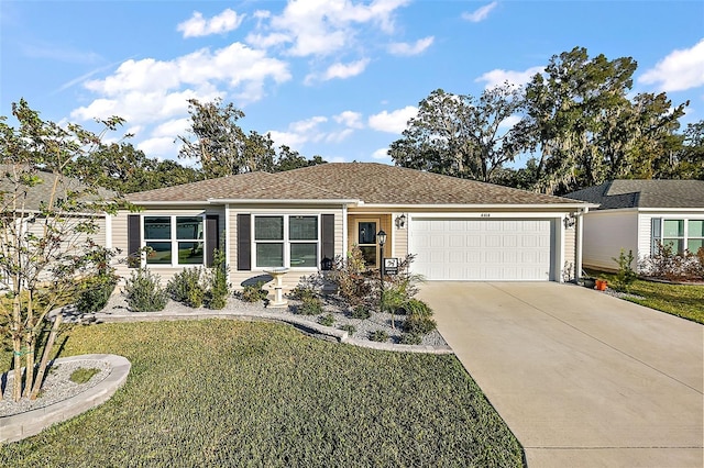 single story home with a garage and a front yard