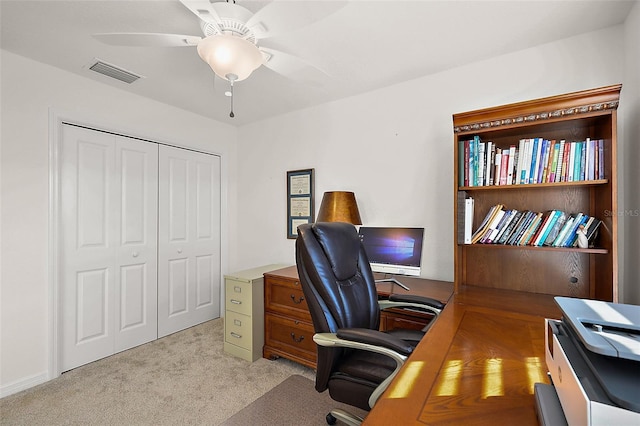 office space with ceiling fan and light colored carpet