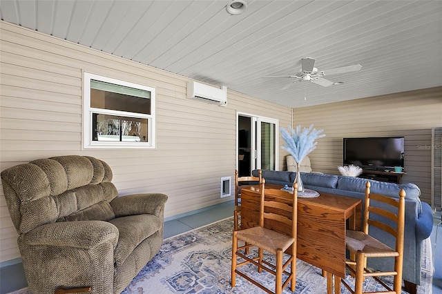 exterior space featuring a wall unit AC, ceiling fan, and wooden walls