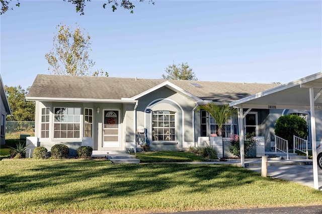 ranch-style house with a front yard