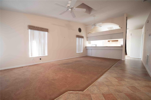 unfurnished living room featuring ceiling fan and light carpet