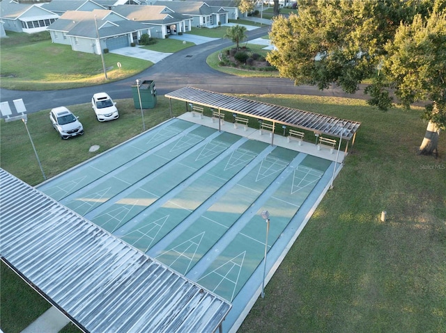 view of property's community featuring a yard