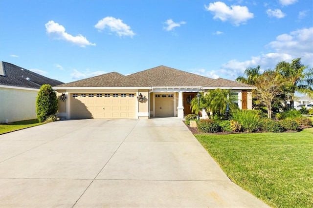 view of front facade featuring a front yard and a garage