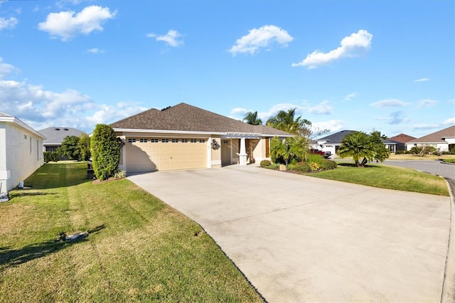 view of front of house featuring a front lawn and a garage