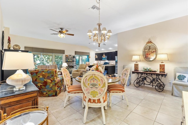 tiled dining room featuring ceiling fan with notable chandelier