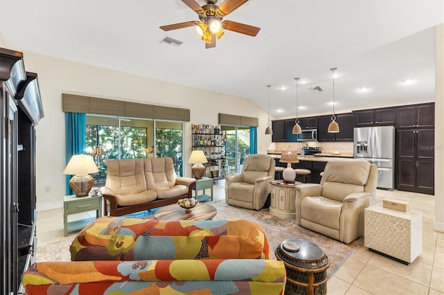 tiled living room with ceiling fan and lofted ceiling