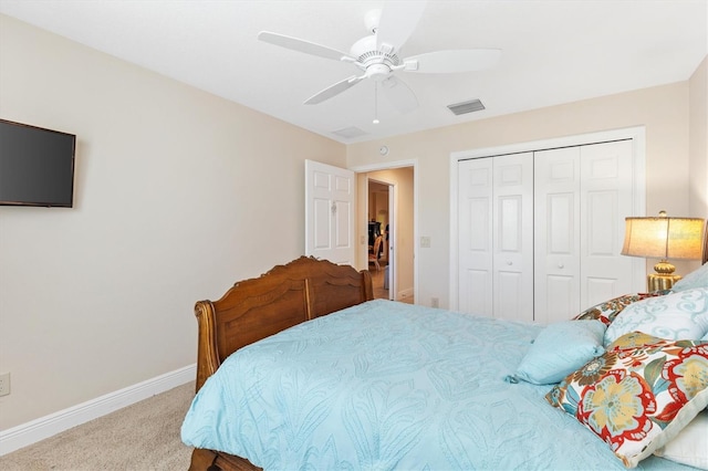 carpeted bedroom with a closet and ceiling fan