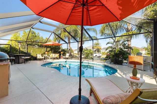 view of swimming pool with exterior bar, a patio, and a lanai