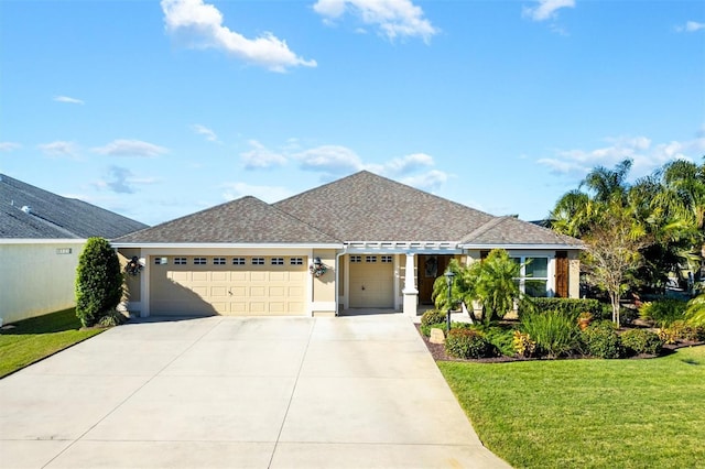 view of front facade featuring a garage and a front lawn