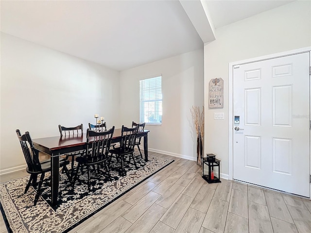 dining space featuring light wood-type flooring