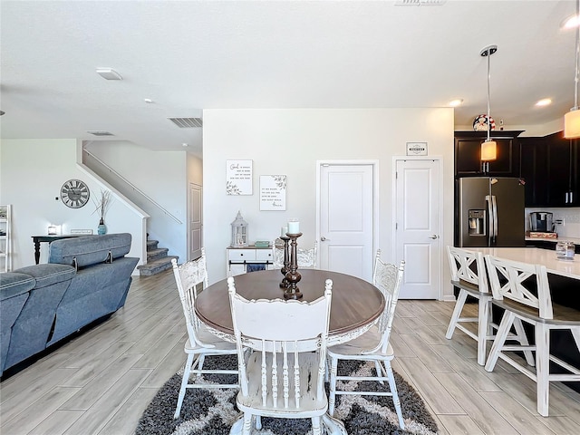 dining area with light wood-type flooring