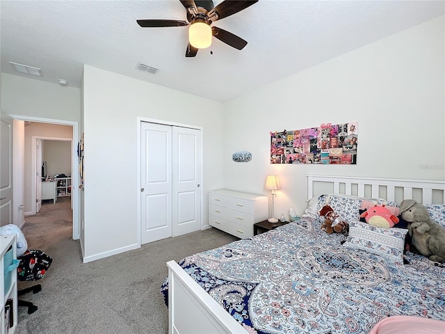 bedroom featuring ceiling fan, a closet, and light carpet