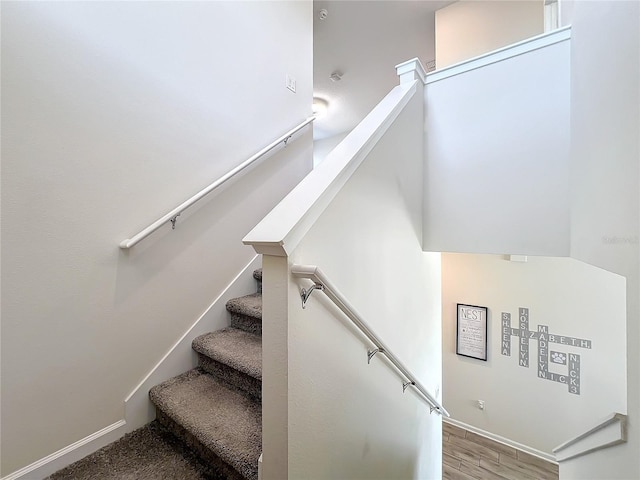 staircase featuring hardwood / wood-style flooring