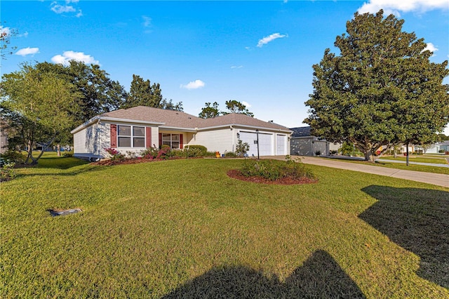 ranch-style home featuring a garage and a front lawn