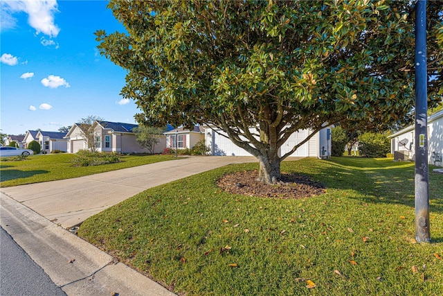 view of front of house with a front yard and a garage