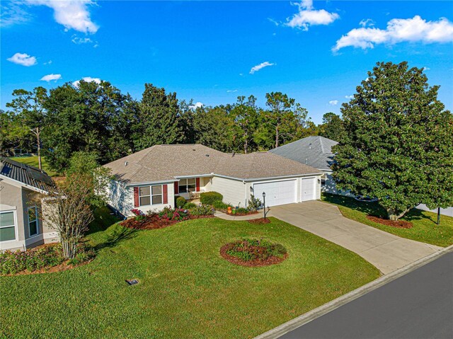 ranch-style home with a front yard and a garage