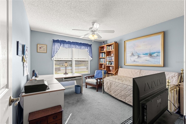 bedroom featuring ceiling fan, carpet floors, and a textured ceiling