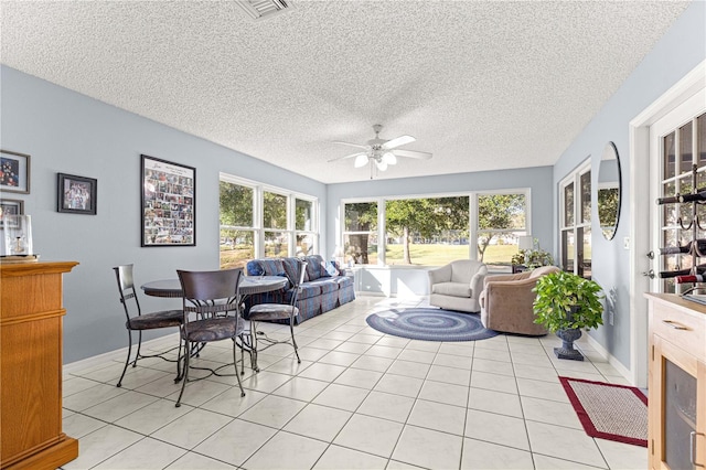 sunroom / solarium with ceiling fan