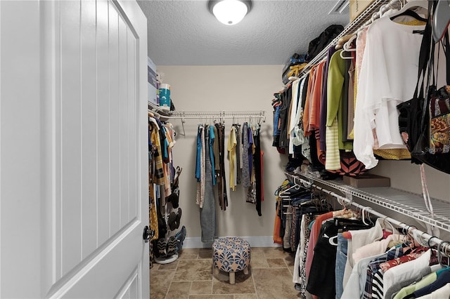 spacious closet featuring visible vents