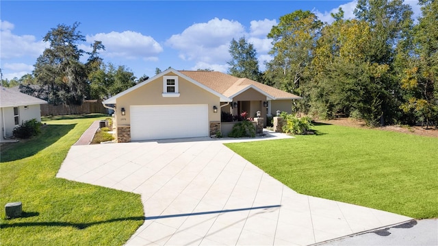 view of front facade featuring driveway, a front lawn, stone siding, and stucco siding