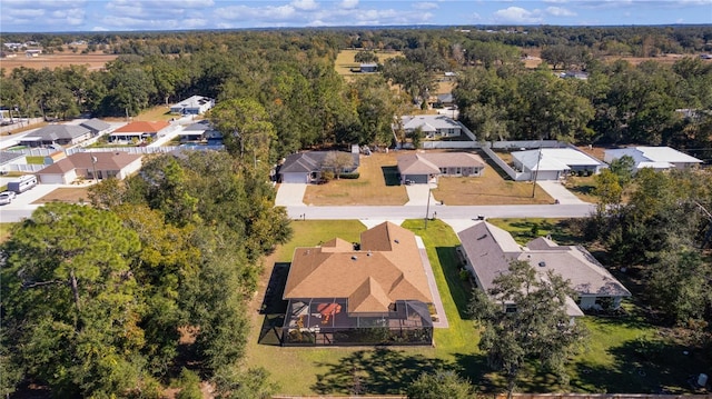 bird's eye view with a residential view and a wooded view