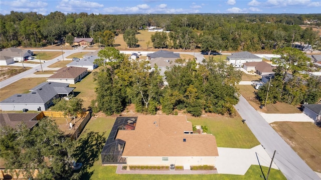 birds eye view of property featuring a residential view and a view of trees