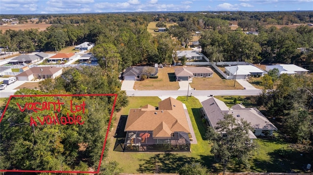 bird's eye view with a residential view and a view of trees