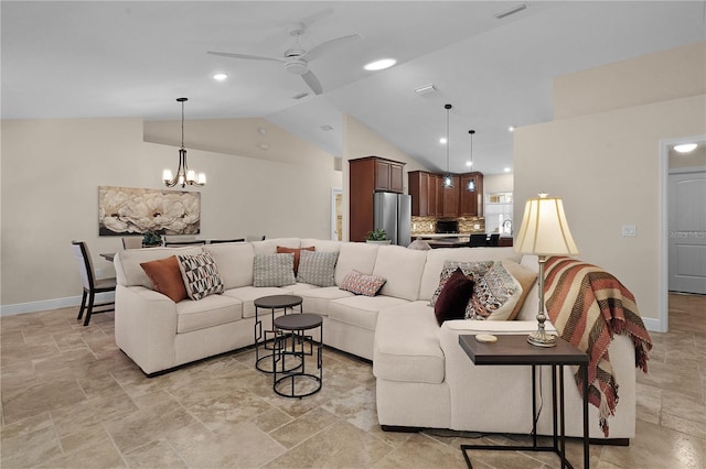 living room featuring visible vents, stone finish flooring, vaulted ceiling, baseboards, and ceiling fan with notable chandelier