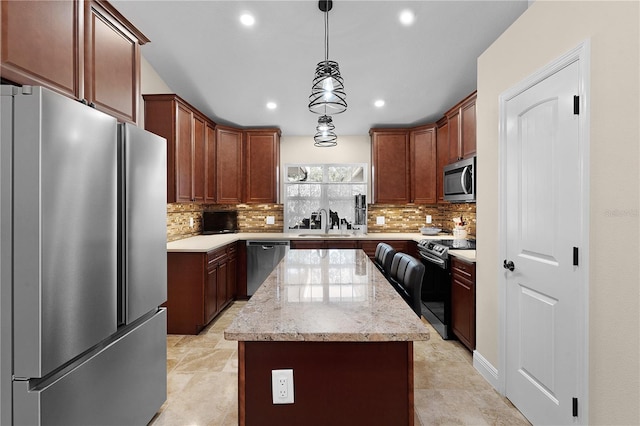 kitchen with tasteful backsplash, a kitchen island, light stone counters, stainless steel appliances, and a sink