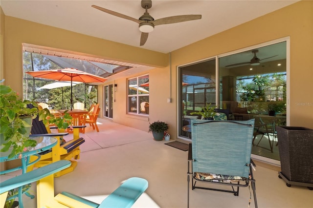 view of patio / terrace with outdoor dining area and a ceiling fan