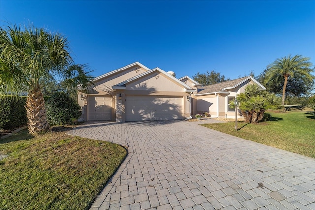 ranch-style home with a garage and a front yard