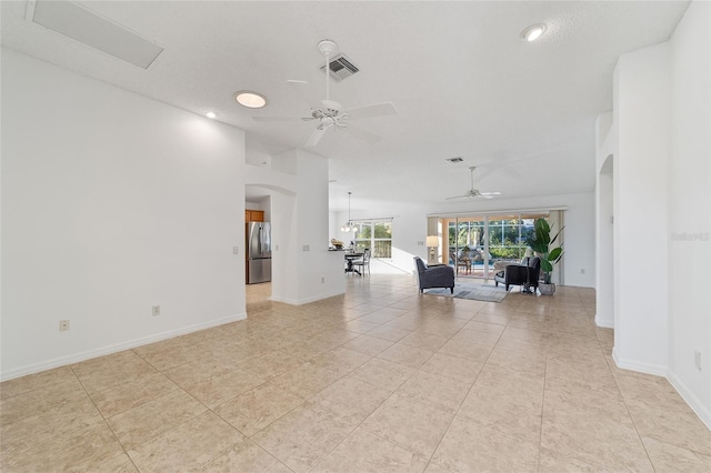 interior space with ceiling fan and light tile patterned flooring