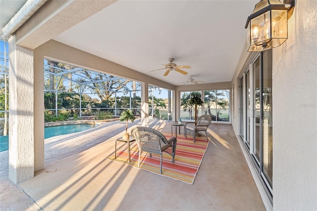 view of patio featuring a lanai and ceiling fan