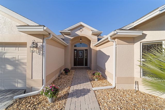 doorway to property featuring a garage