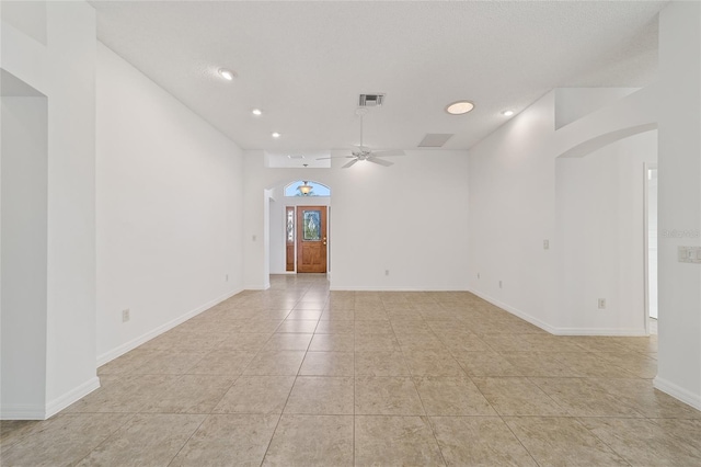 tiled empty room with ceiling fan